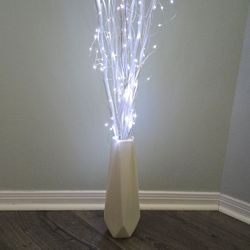 Vase with Branches and Lights
