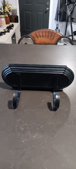 BLACK METAL SHELF WITH TWO HOOKS  MEASURES  12 ACROSS AND 5 WIDTH