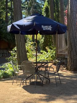 Heavy duty Wrought iron table for emu, metal chairs, Samuel Adams umbrella and 80 lb Tuuci umbrella base