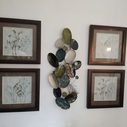 Four frames and a leaf metal sculpture