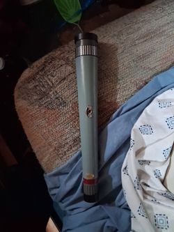 The item is a vintage Bushnell 10 Power, 30mm pocket/handheld telescope (Model 16-7002, made in Japan)