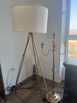 $70 Modern Gold Metal Glass Bar Table (42” L x 32”H) , $60 Coffee Table (32” Diameter), $50 Candelabra, $40 Modern Floor Lamp, $50 Each Black Cabinet