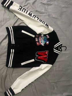 Copper Rivet varsity jacket, black and white, with embroidered sports-themed patch, size S.