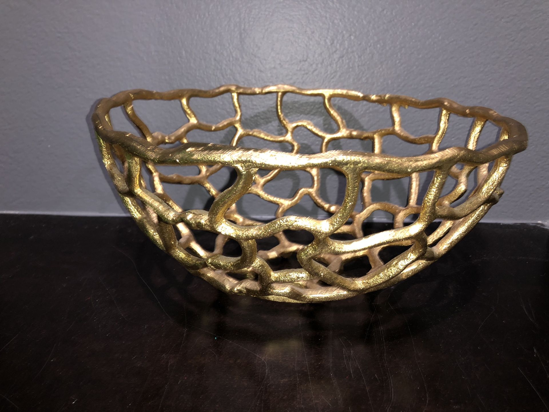 Gold colored fruit bowl