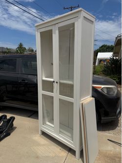 Glass cabinet with shelves
