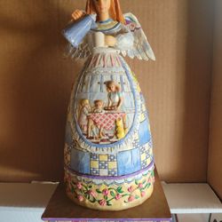 Carved Figurine Giving Mom