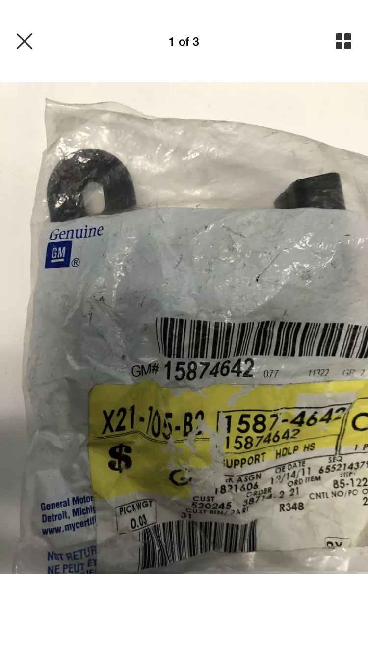 OEM GM headlight lamp support bracket part # 15874642