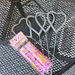Heart shaped sparklers and pink smoke sticks