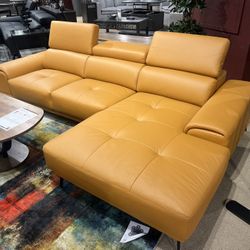 New Left Or Right Facing Chaise.  Leather Match /Metal Legs.  Tangerine 🍊/Grey/Black.  111”x68”Dx29”H.  Free Delivery!