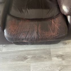 Very Used Leather Reclining Sofa and Loveseat