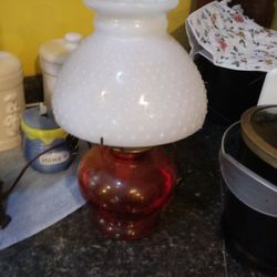 Vintage red oil lamp with white milk glass hobnail top