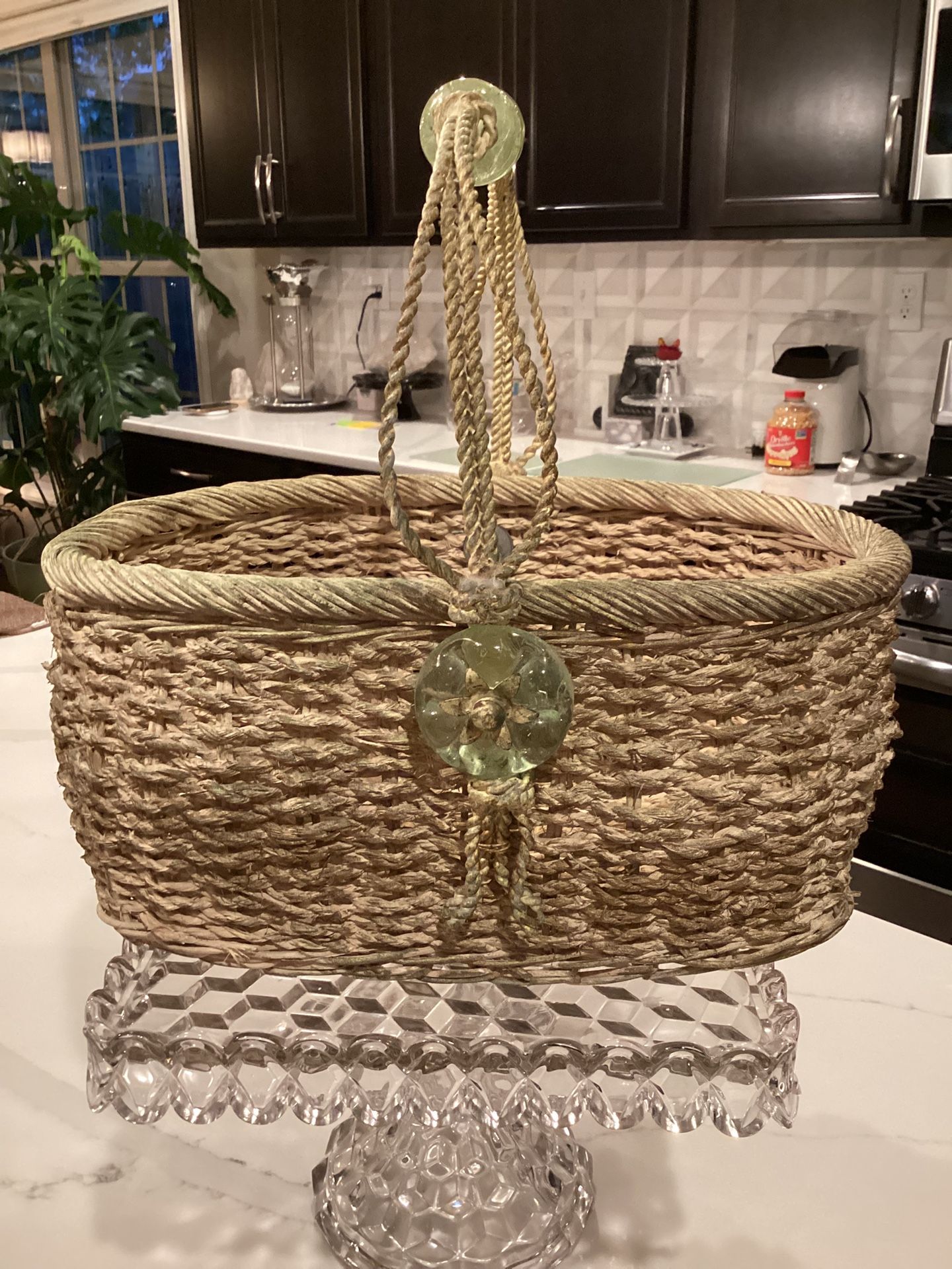 Heavy distressed basket with metal handles and decorative acrylic trim 13”T, 9”W, 14”L, 5”deep