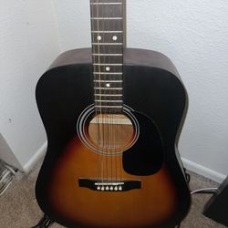 Lauren acoustic guitar with capo