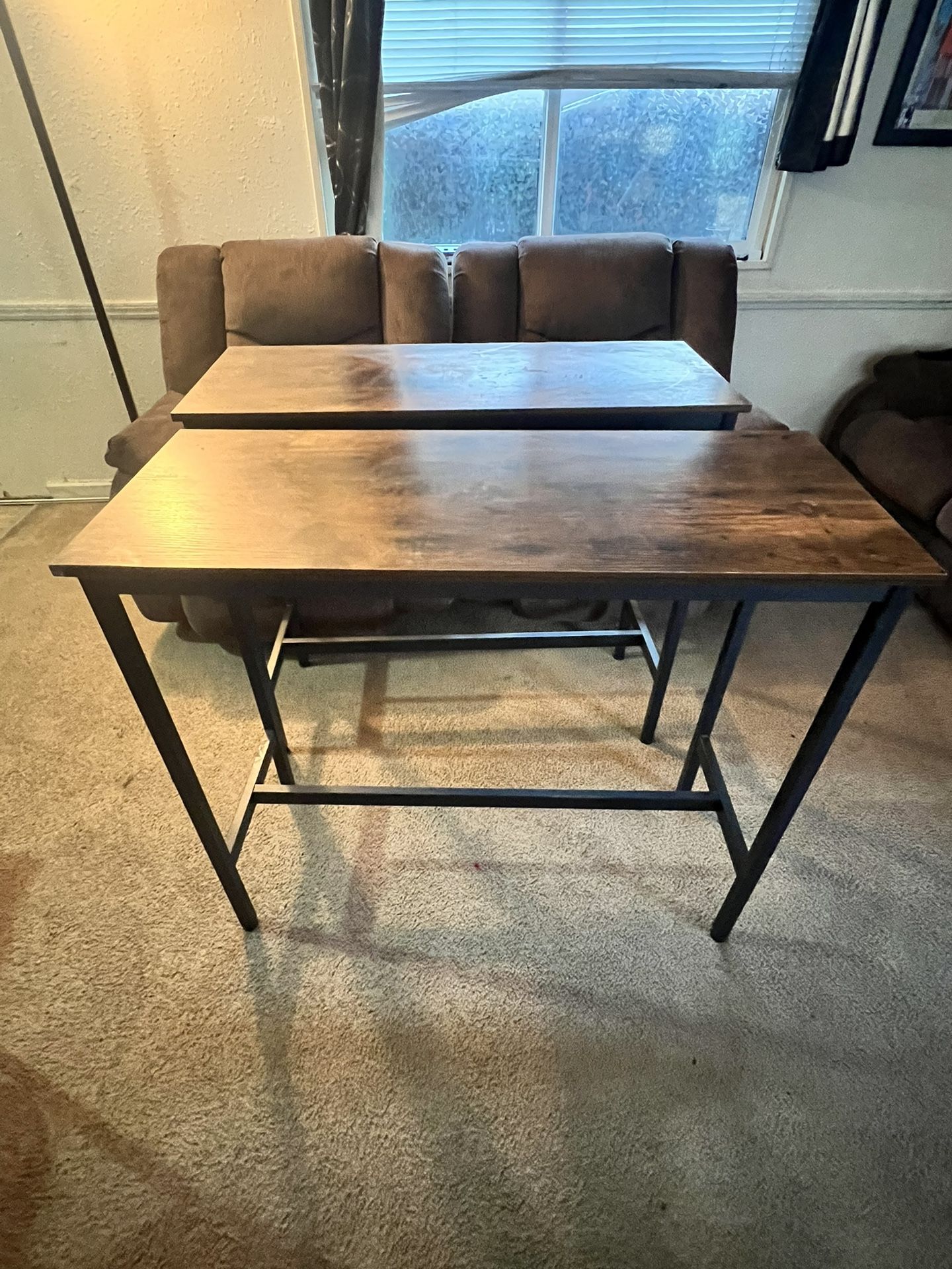 Two sets of barstools and tables