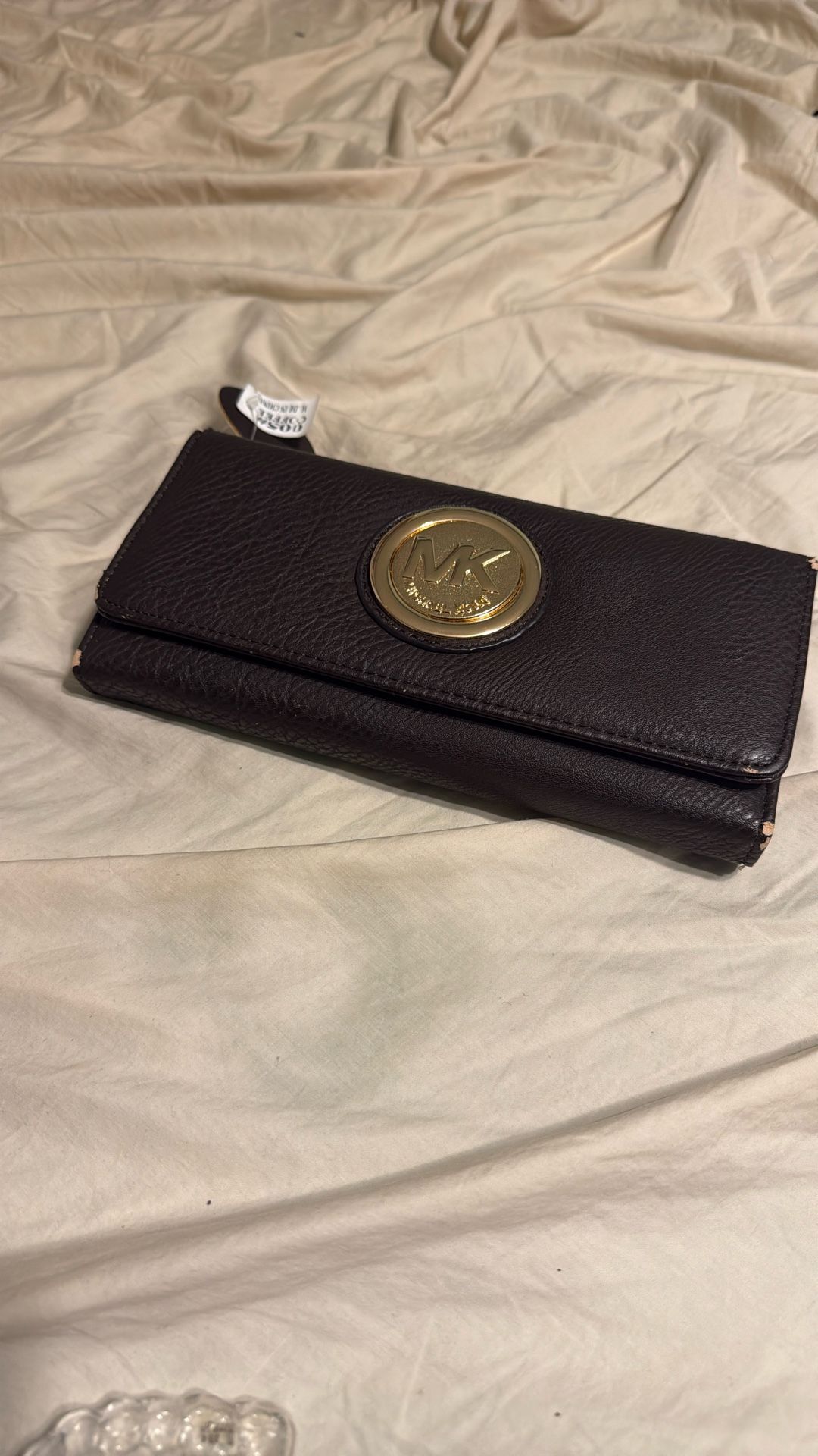 MK wallet Slight Peeling On Sides