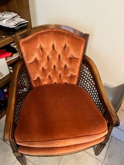 2 chairs with wicker arms.