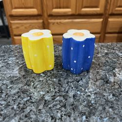 Ceramic Polka Dotted Flowers pair of Salt and Pepper Shakers. Size approximately 2 3/4 inches tall.