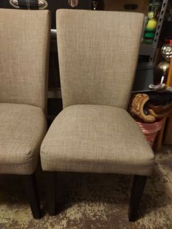 Two cream dining room chairs