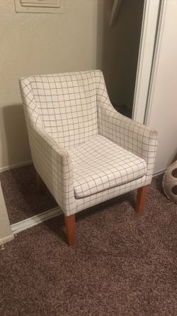 Swoop arm dining chair with a grid pattern