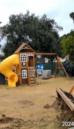 Playground tunnel slide with swings