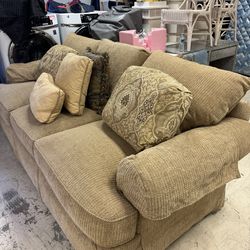 Thomasville sofa in a gold diamond chenille fabric featuring overstuffed cushions, rolled panel arms, and a floor-length skirt - Excellent Condition