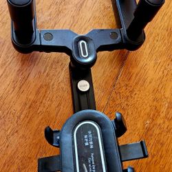 Car/SUV Phone holder.  Clamps onto rearview mirror.    360 degree adjustable.   Black.