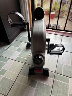 Resistant arm and leg pedal exerciser.