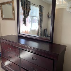 Brown dresser with mirror