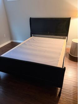 FREE. Black queen bed frame and box spring