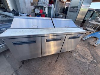 Three-door refrigerated prep table; very clean and in perfect working order.