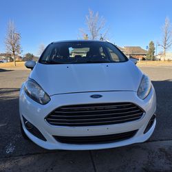 White 2016 Ford Fiesta SE Sedan.