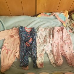 Newborn feet in onesies