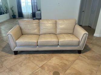 Cream colored leather sofa