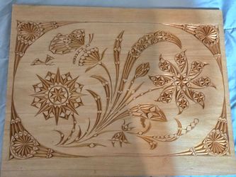 hand-carved light wood serving tray featuring two designs, the carved wood flips over