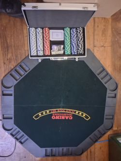 Poker table with chips and cards and dice