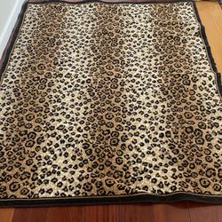 Leopard Area Rugs 4 X 5    ( 2)  Clean in great condition.$10   Each.   Custom Made Gorgeous fabric flower arrangement in unique vase. Large. $25