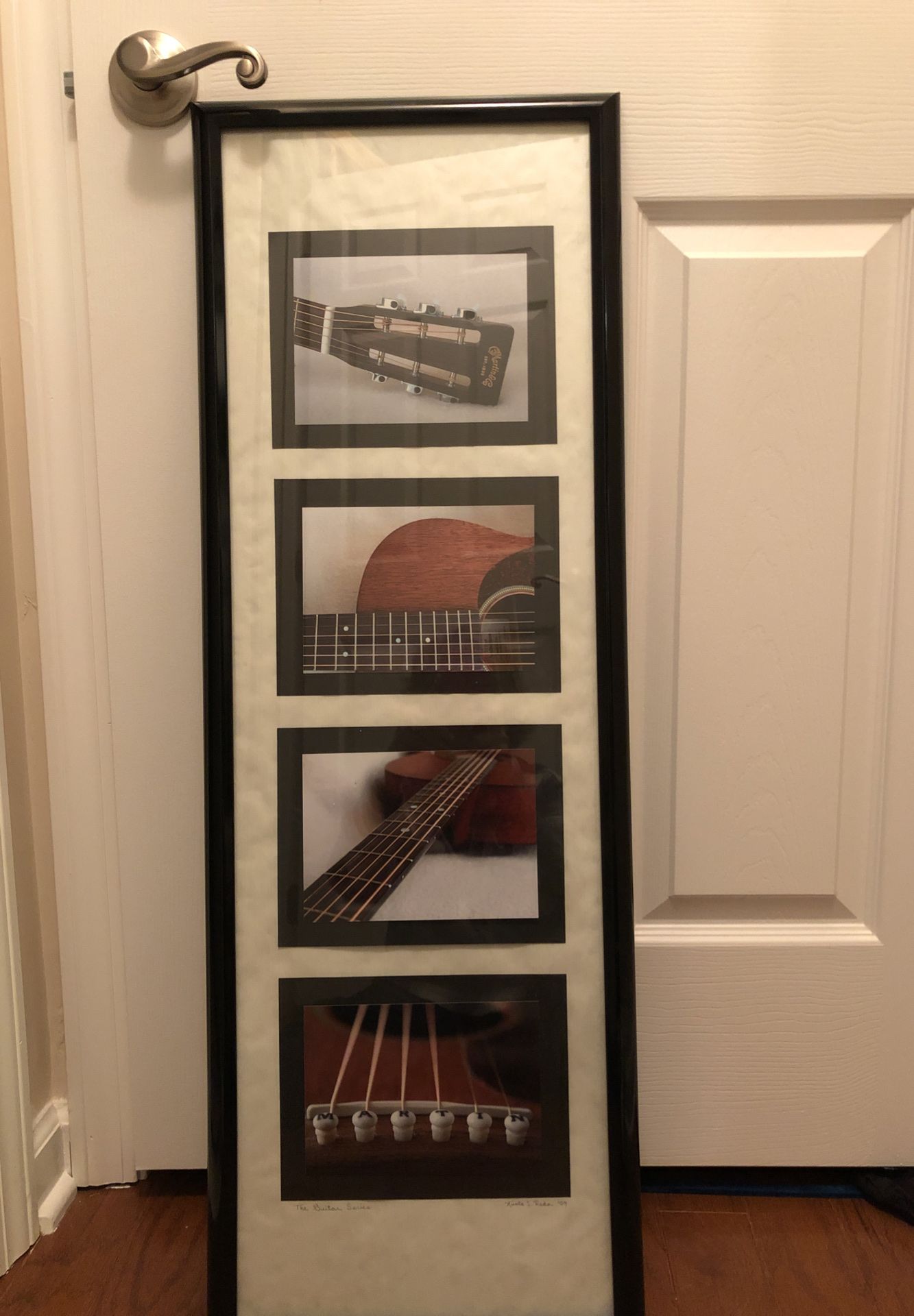 Picture of pieces of a guitar. Never even been hung