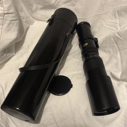 Vivitar Telephoto Lens 400 mm With a Hard Case.