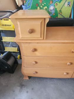 This is a Pali natural wood changing table and dresser combo with a single elevated drawer