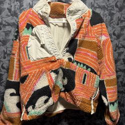 FP Movement Rocky Ridge Pullover Orange Wave Pullover Sz M  The FP Movement Rocky Ridge Pullover in Orange Wave is a stylish and functional jacket des