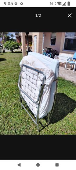 Folding Metal Frame Bed With Mattress And Wheels. Good Condition