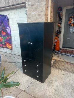Black armoire storage closet