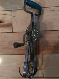 Blue whirl antique hand mixer
