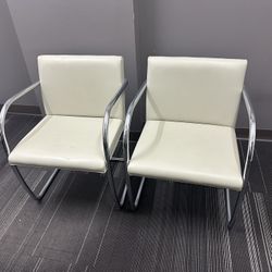 2 Mid-Century American White Leather and Chrome Tube Armchairs