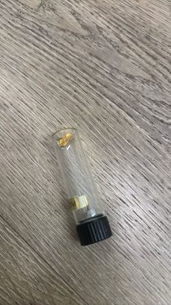Gold flakes in jar