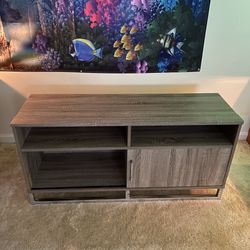 Room Essentials TV Stand With Metal Sled Base and Sliding Door