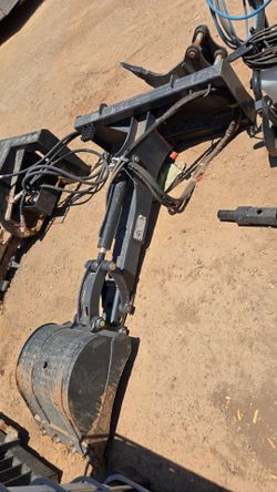 Skid steer back hoe bucket attachment
