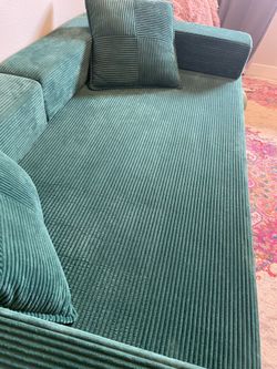 Stylish green sofa bed conversion