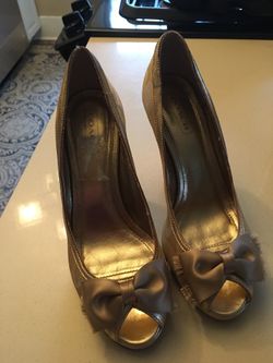 Nice pair of gold COACH shoes