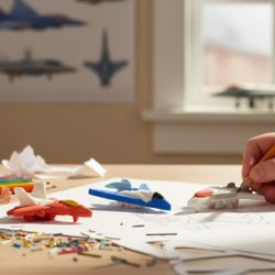 (Lot Of 3) 3D Puzzle 1" Miniature Multi-Color Erasers Figural Air-Craft Themed. The image displays three 3D puzzle erasers shaped like different types